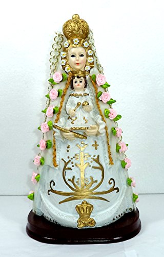 NDA Virgen del Rocío. Medidas: 26x14x10 cms. Aprox. Elaborada en Resina policromada, con Adornos de Flores de Tela, puntilla y Manto Tipo Terciopelo Blanco.