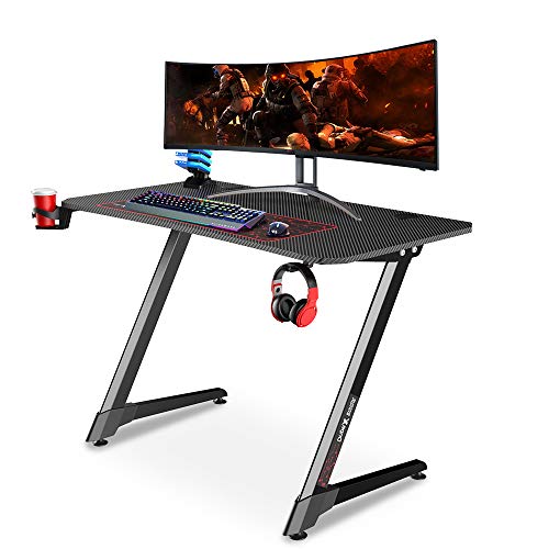 Dripex Mesa Gaming con Tablero de Fibra de Carbono, Gaming Desk 110 x 60 x 75 cm con Soporte para Tazas y Auriculares, Patas Regulables, Negro